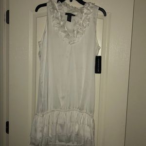 White dress with ruffle collar and base of dress